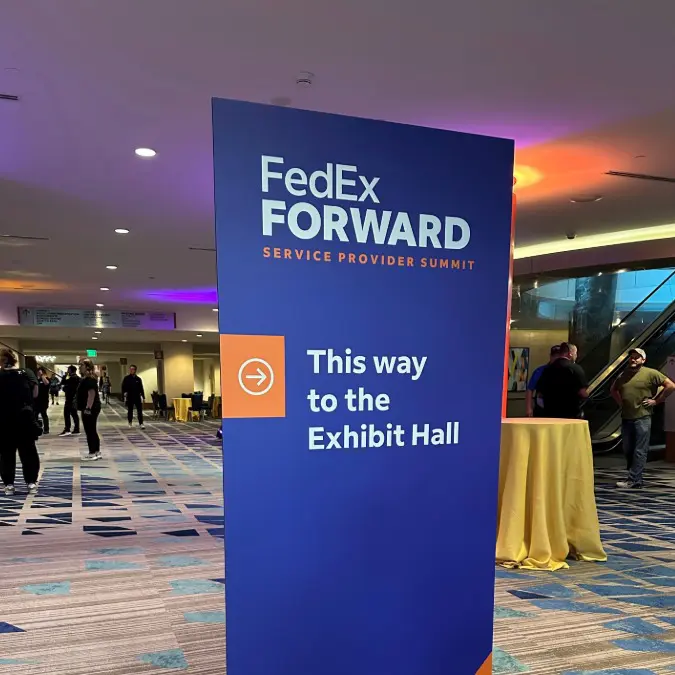 Directional Sign Pointing to Exhibit Hall at FedEx Forward Summit