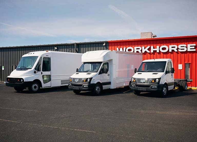 Three Workhorse Electric Commercial Trucks Parked In Front Of The Manufacturing Facility.