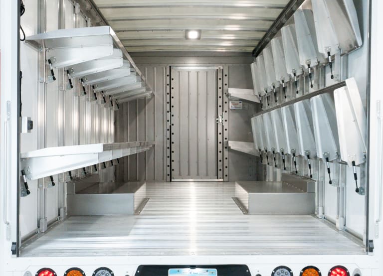 Interior cargo area of W56 electric step van with shelving upfit